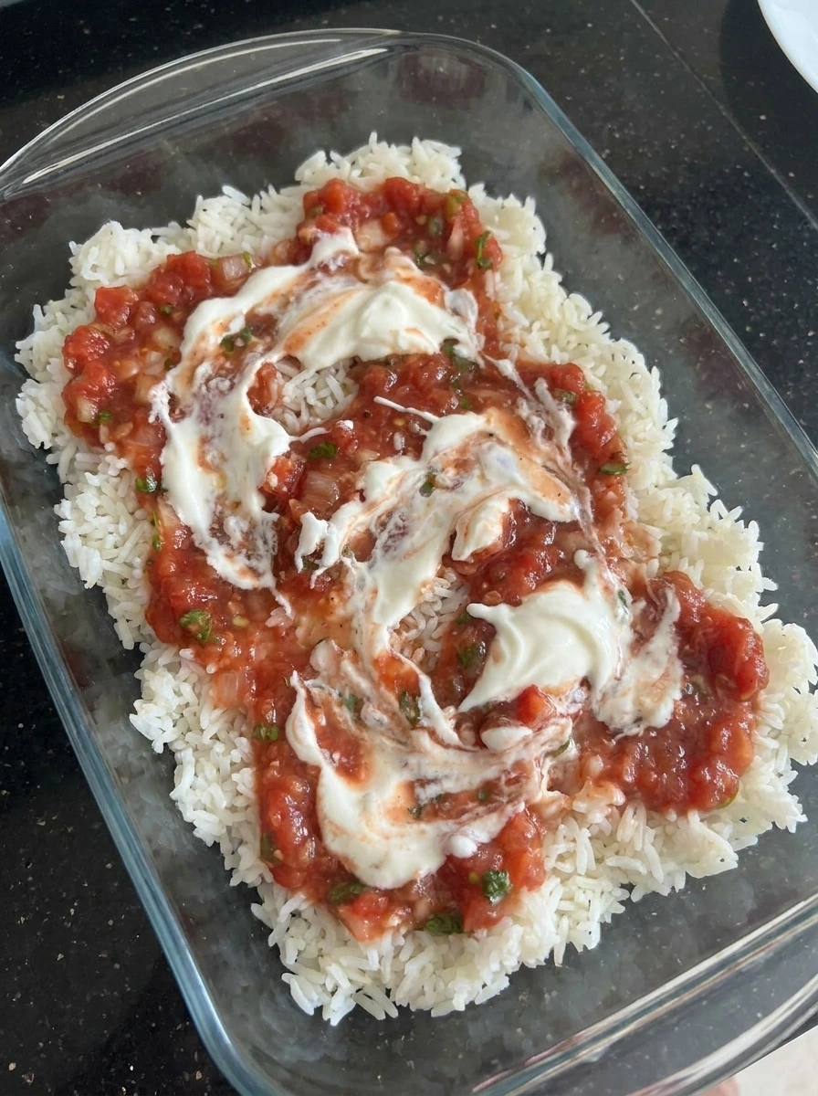Rice layered with salsa and sour cream