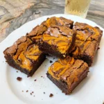 Pumpkin Cheesecake Brownies with fudgy chocolate layers and pumpkin cheesecake swirls
