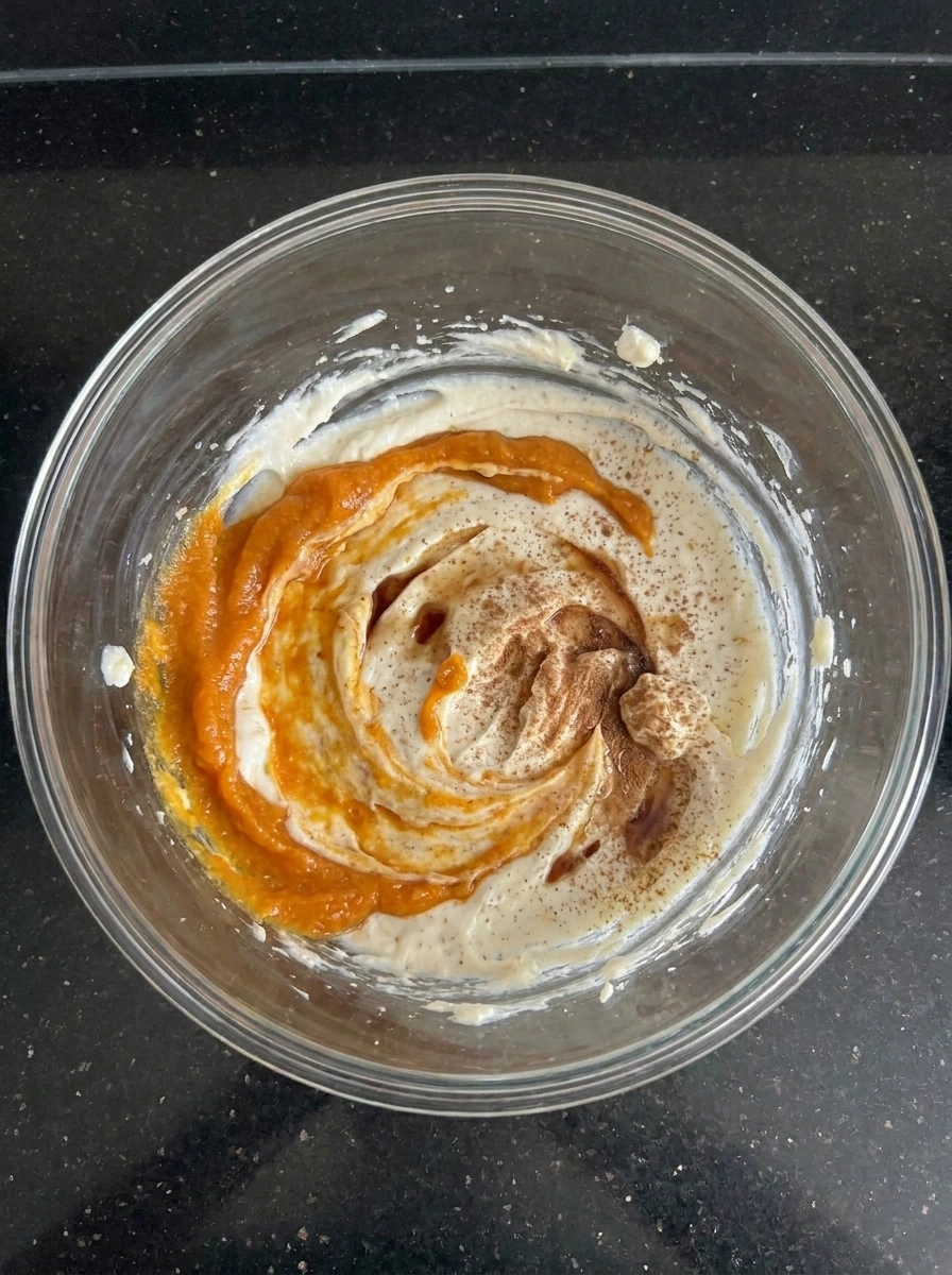 Pumpkin puree and spices folded into Pumpkin Cheesecake Dip