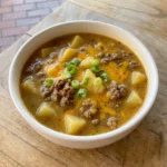 Cheesy Hamburger Potato Soup with browned beef and tender potatoes in creamy cheddar broth