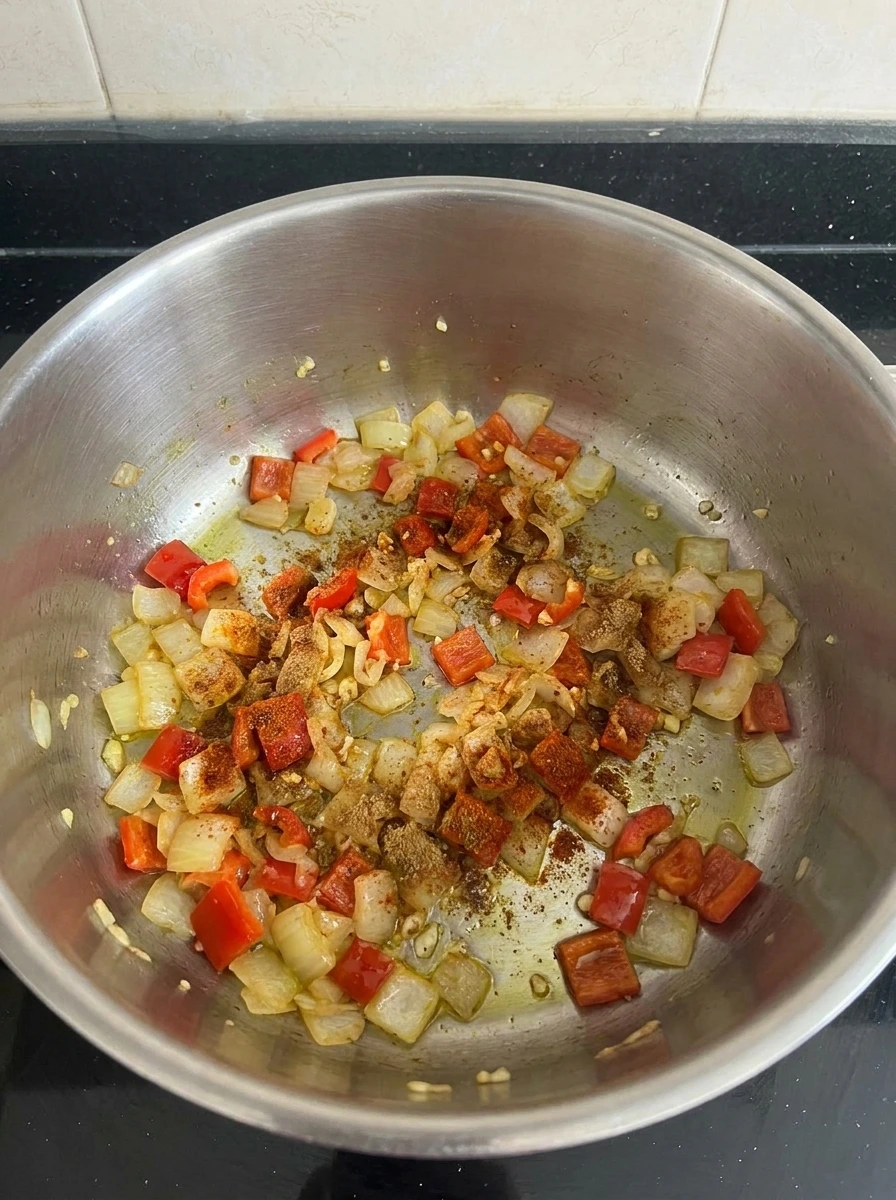 Softened onion and red pepper for Chicken Enchilada Soup