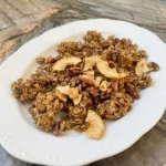 Homemade Cinnamon Apple Granola with golden oat clusters and dried apples