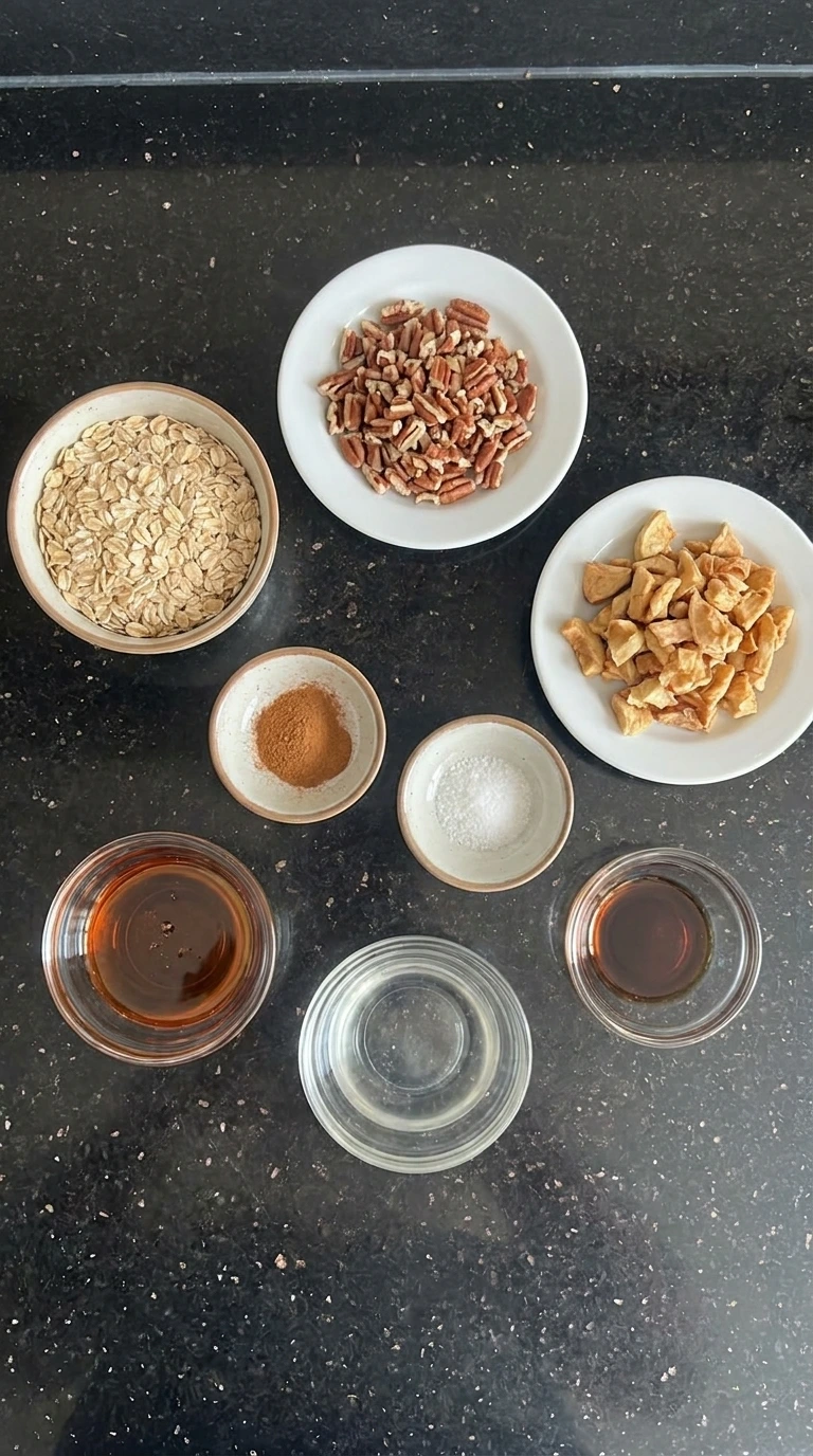 Ingredients for Cinnamon Apple Granola in separate small containers