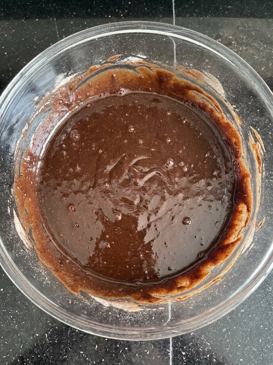 Chocolate batter mixed for Classic Fudge & Crunch Cake