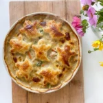 Halloween Pot Pie with golden puff pastry ghosts over creamy chicken filling