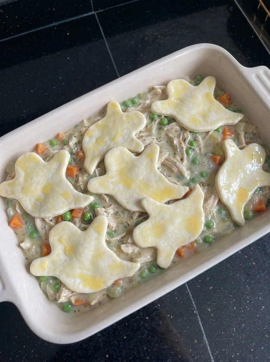 Halloween Pot Pie topped with puff pastry ghosts before baking