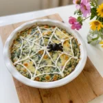 Halloween Spinach Dip with sour cream spiderweb and black olive spider